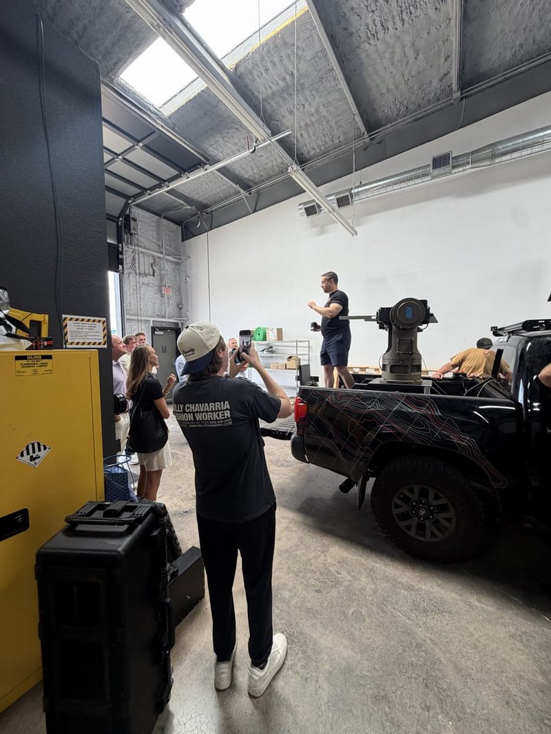 The Allen Control Systems team with a Bullfrog counter-drone system mounted on a truck bed